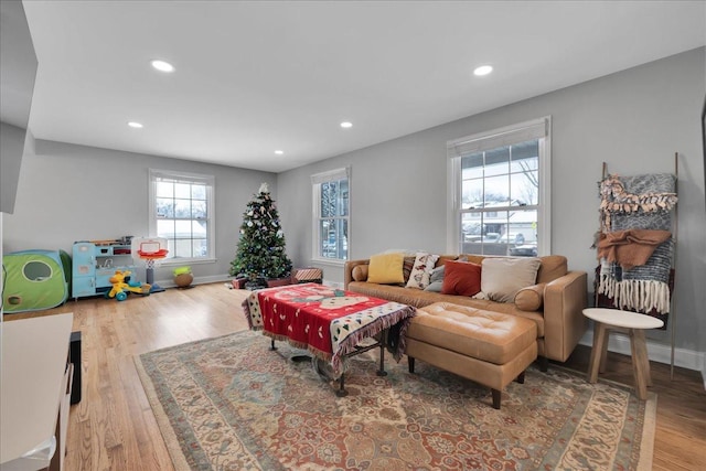 living room with plenty of natural light and wood-type flooring