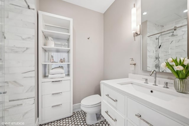 full bath with toilet, a marble finish shower, vanity, and baseboards