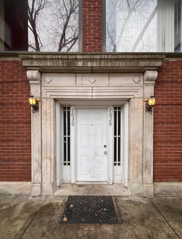 7628 S Essex Ave Unit 1N, Chicago, IL 60649 - view of exterior entry featuring brick siding