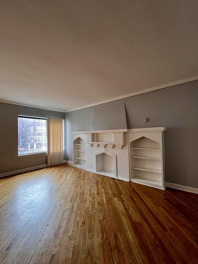 unfurnished living room featuring hardwood / wood-style flooring