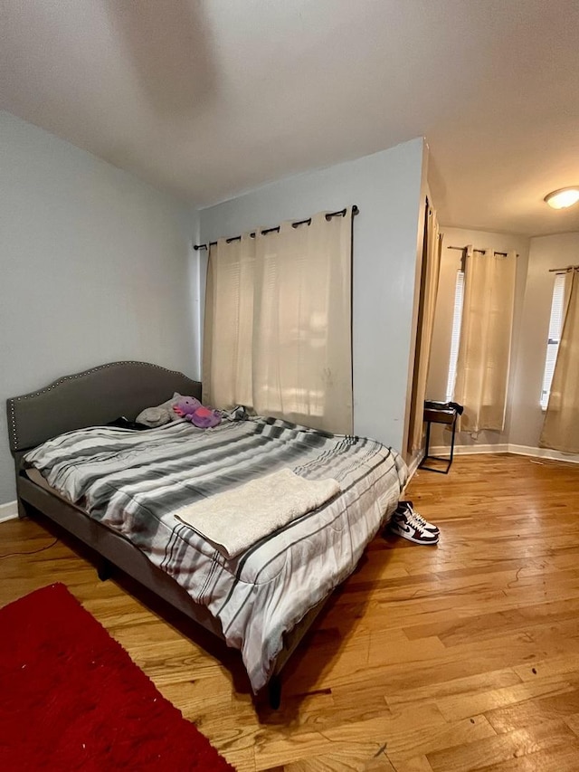 bedroom with light wood-type flooring