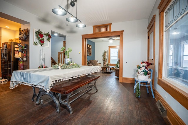 dining area featuring dark hardwood / wood-style floors, a healthy amount of sunlight, and ceiling fan