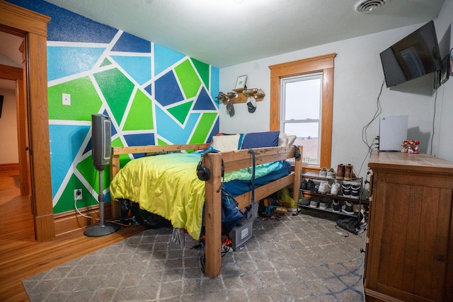 bedroom with dark wood-type flooring