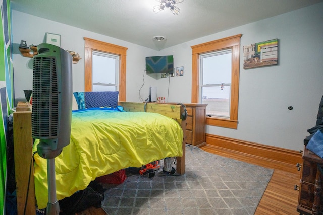 bedroom featuring hardwood / wood-style floors