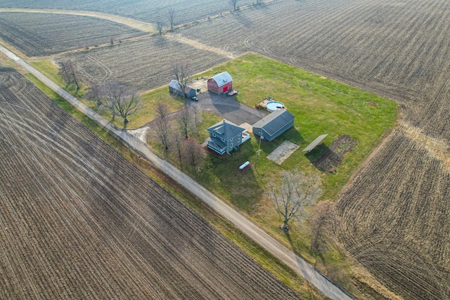 birds eye view of property with a rural view