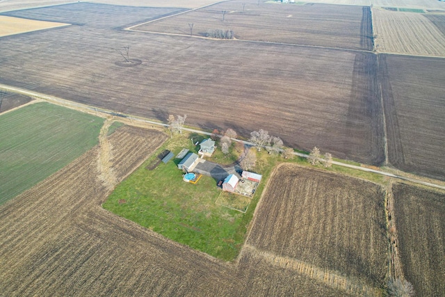 birds eye view of property featuring a rural view