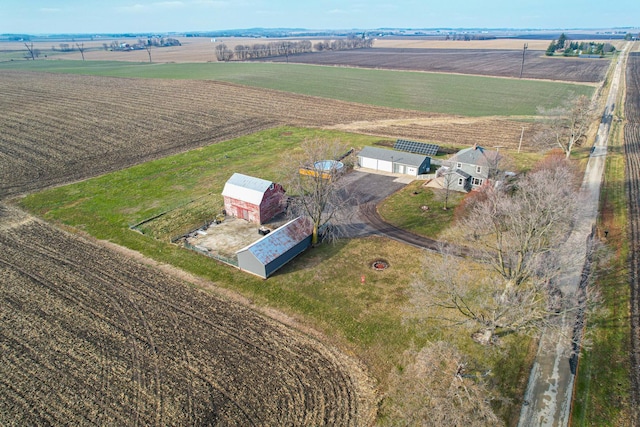 birds eye view of property with a rural view