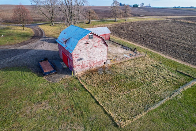 birds eye view of property with a rural view