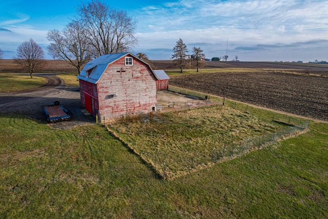 exterior space with an outbuilding and a rural view