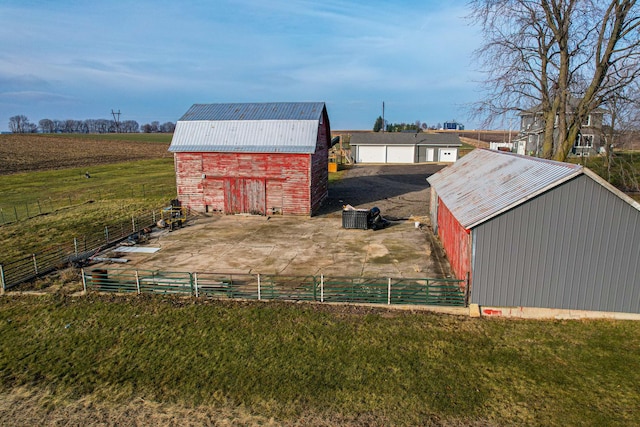 view of outbuilding with a rural view