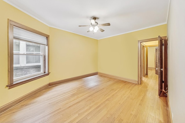 unfurnished room with crown molding, ceiling fan, and light wood-type flooring