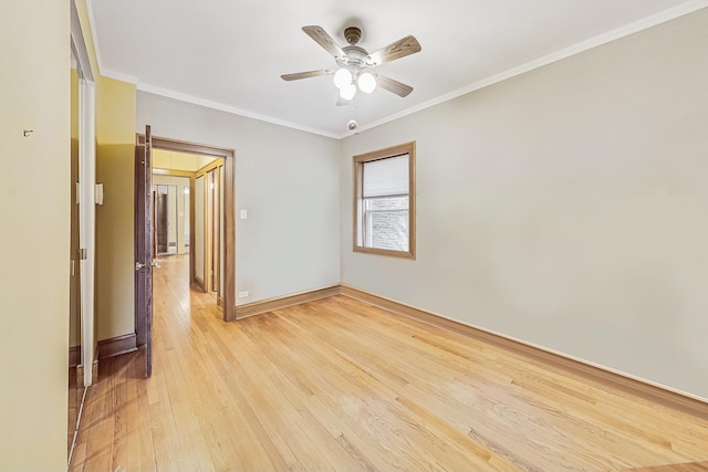 spare room featuring crown molding, ceiling fan, and light hardwood / wood-style flooring