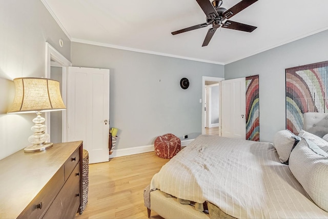 bedroom with crown molding, ceiling fan, and light wood-type flooring