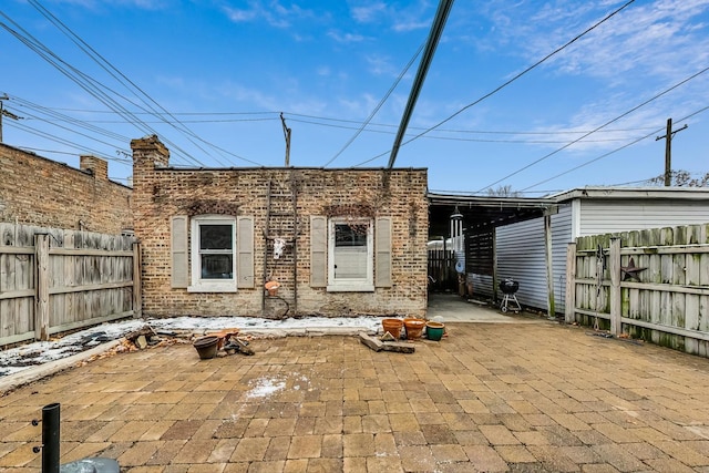 rear view of property featuring a patio