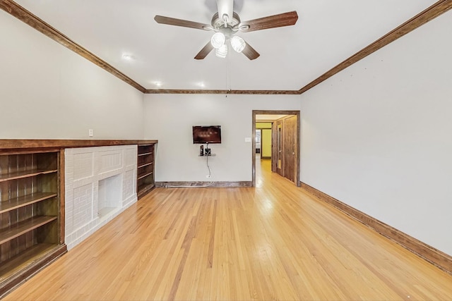 unfurnished living room with crown molding, a fireplace, ceiling fan, and light wood-type flooring