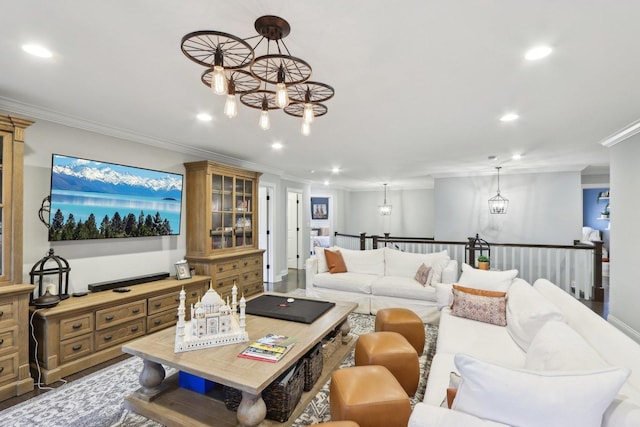 living room featuring a chandelier and ornamental molding