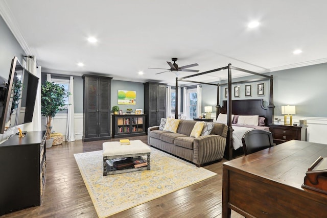 bedroom with dark hardwood / wood-style flooring, ceiling fan, multiple windows, and ornamental molding