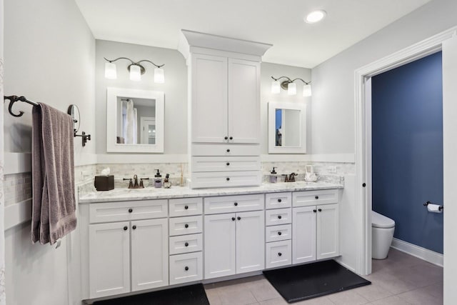 bathroom featuring tile patterned floors, backsplash, vanity, and toilet