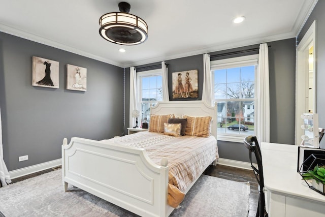 bedroom featuring multiple windows, crown molding, and dark wood-type flooring