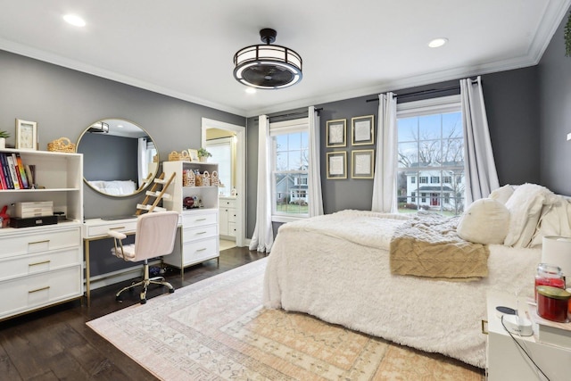 bedroom with crown molding and dark hardwood / wood-style floors