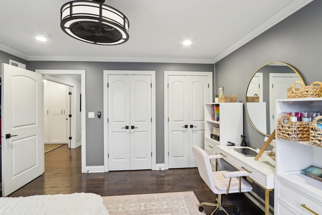 home office with crown molding and dark hardwood / wood-style floors