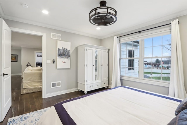 bedroom featuring dark wood-type flooring and crown molding