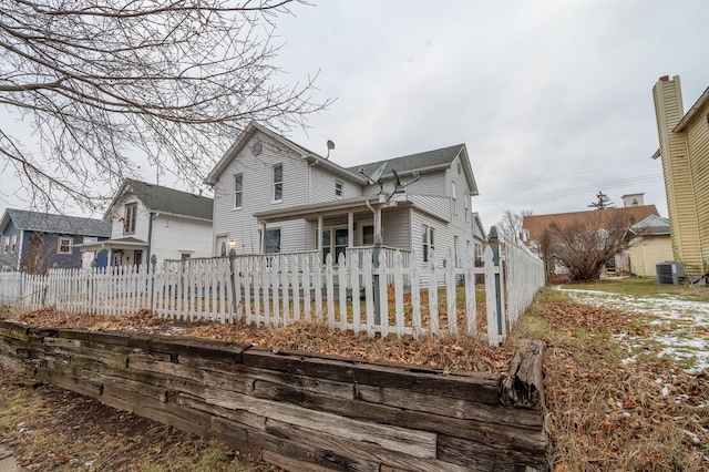 rear view of house featuring covered porch and central air condition unit