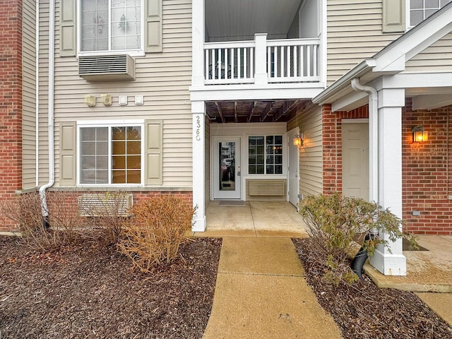 entrance to property featuring a balcony