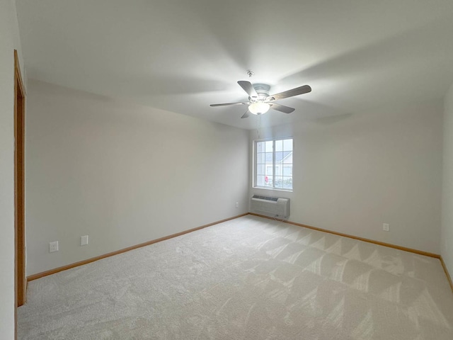 unfurnished room with light carpet, an AC wall unit, and ceiling fan