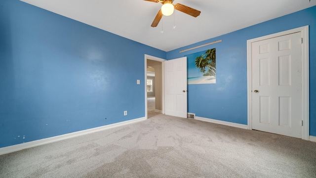 unfurnished bedroom with carpet flooring and ceiling fan