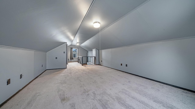 bonus room featuring light carpet and lofted ceiling