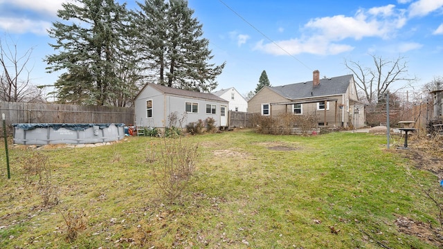 view of yard featuring a covered pool