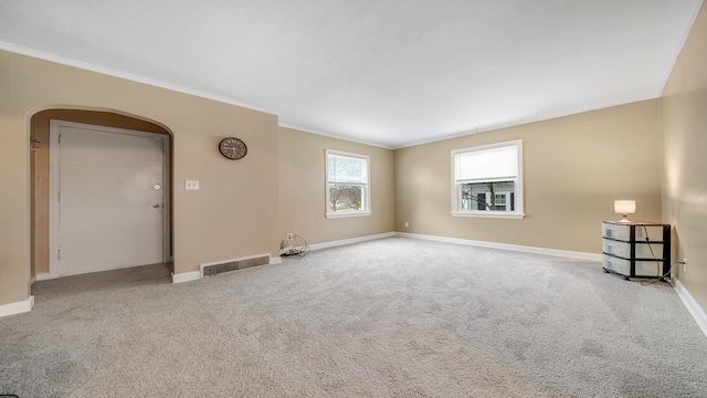 carpeted empty room with ornamental molding