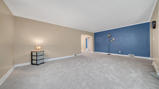 carpeted empty room featuring ornamental molding