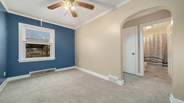 unfurnished room with light colored carpet, ceiling fan, and crown molding