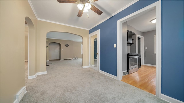 hall with light colored carpet and ornamental molding