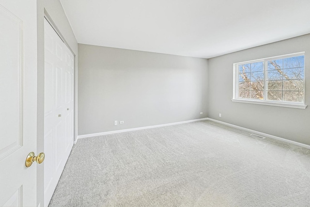 unfurnished bedroom with a closet and carpet