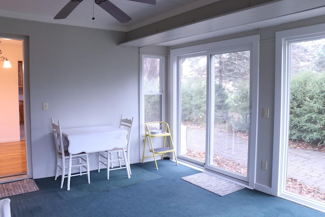 entryway featuring carpet floors and ceiling fan