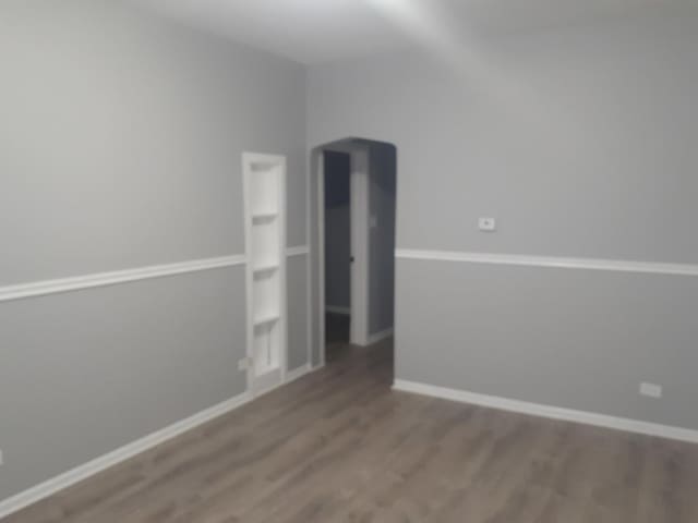 unfurnished room featuring hardwood / wood-style flooring