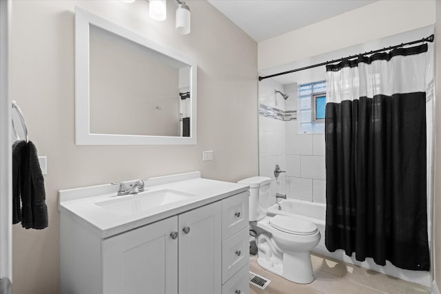 full bathroom featuring tile patterned floors, vanity, toilet, and shower / tub combo