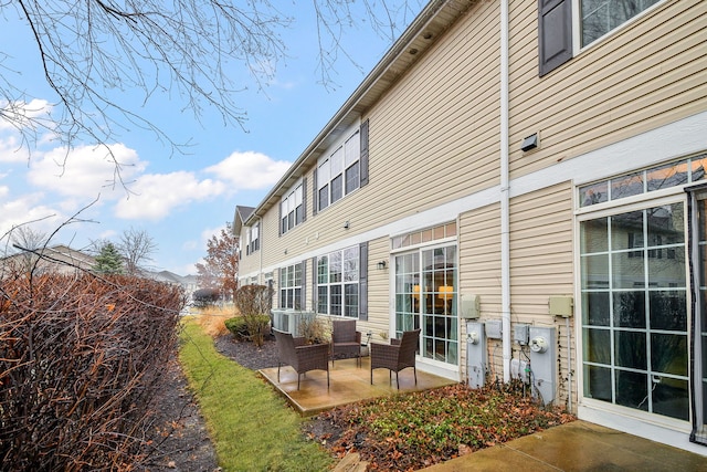 rear view of property featuring a patio