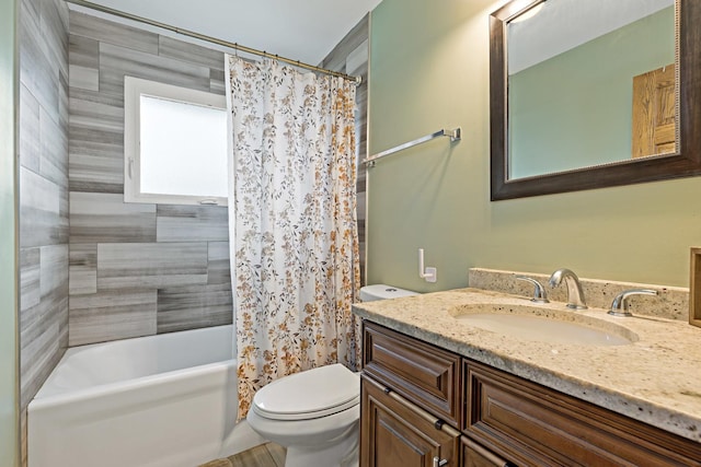 full bathroom featuring vanity, toilet, and shower / tub combo with curtain