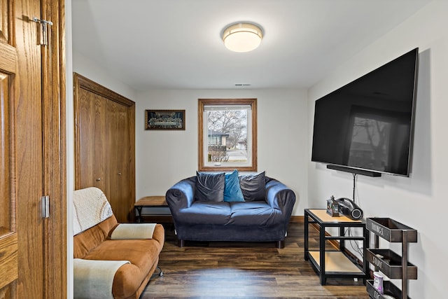 living room with dark hardwood / wood-style flooring