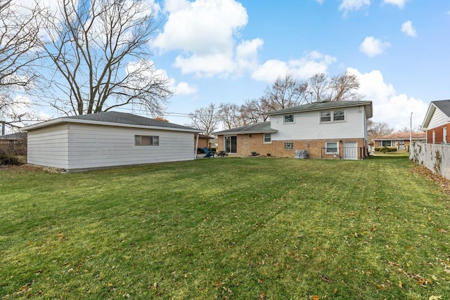 back of house featuring a yard