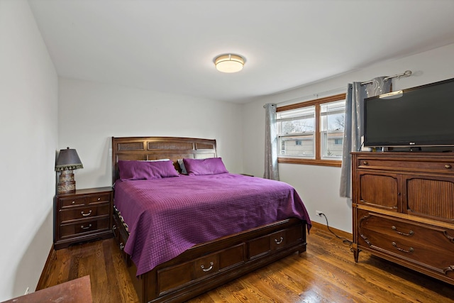 bedroom featuring dark wood-type flooring