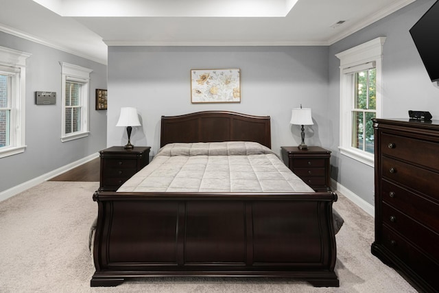 carpeted bedroom featuring crown molding