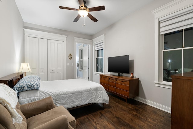 bedroom with ceiling fan, dark hardwood / wood-style floors, and a closet