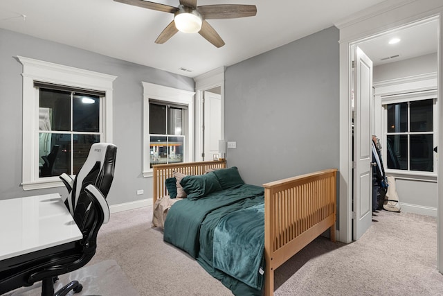 carpeted bedroom featuring ceiling fan