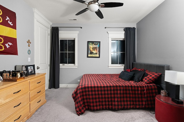 bedroom with light carpet and ceiling fan