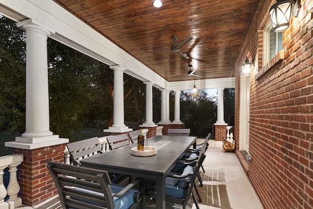 view of patio with ceiling fan and a porch